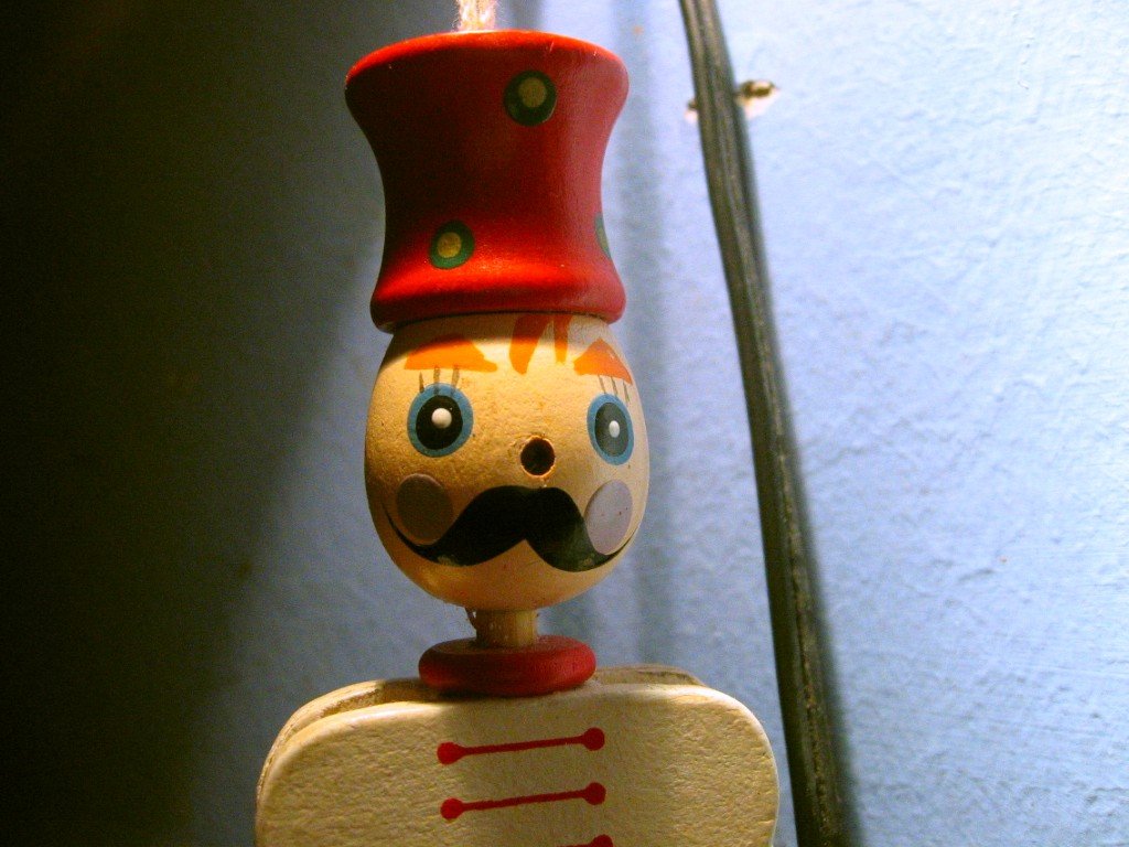 a close up s of a toy with a moustache on top