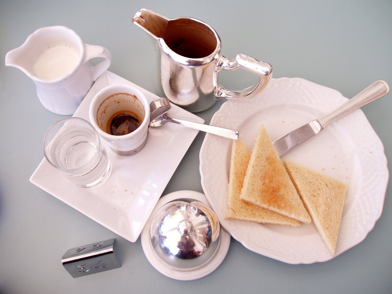 the breakfast consists of toast, milk and coffee