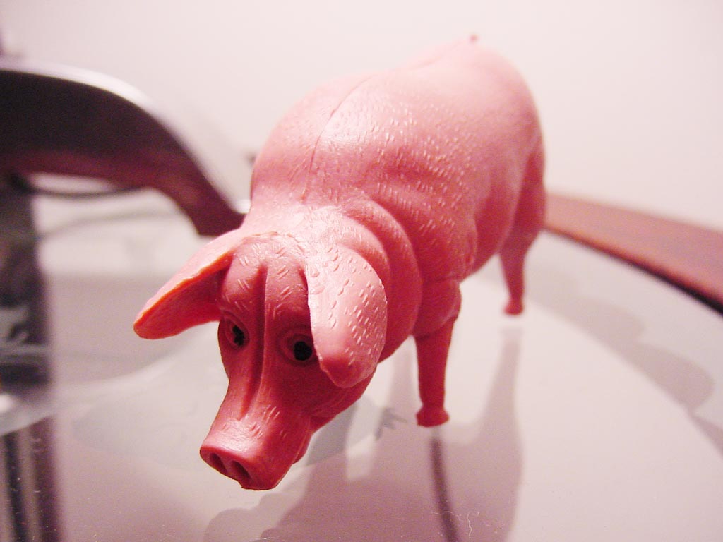 there is a pink toy pig on display