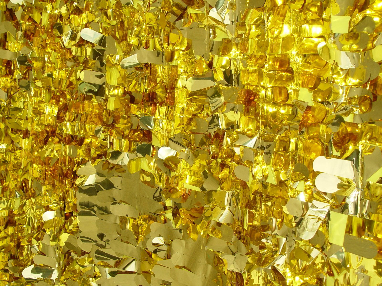 closeup of yellow glitters on a mirror