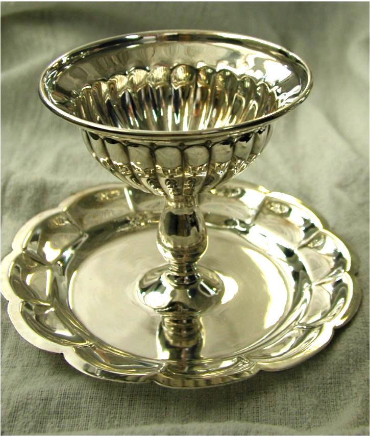 the silver goblet has many small drops of water in it