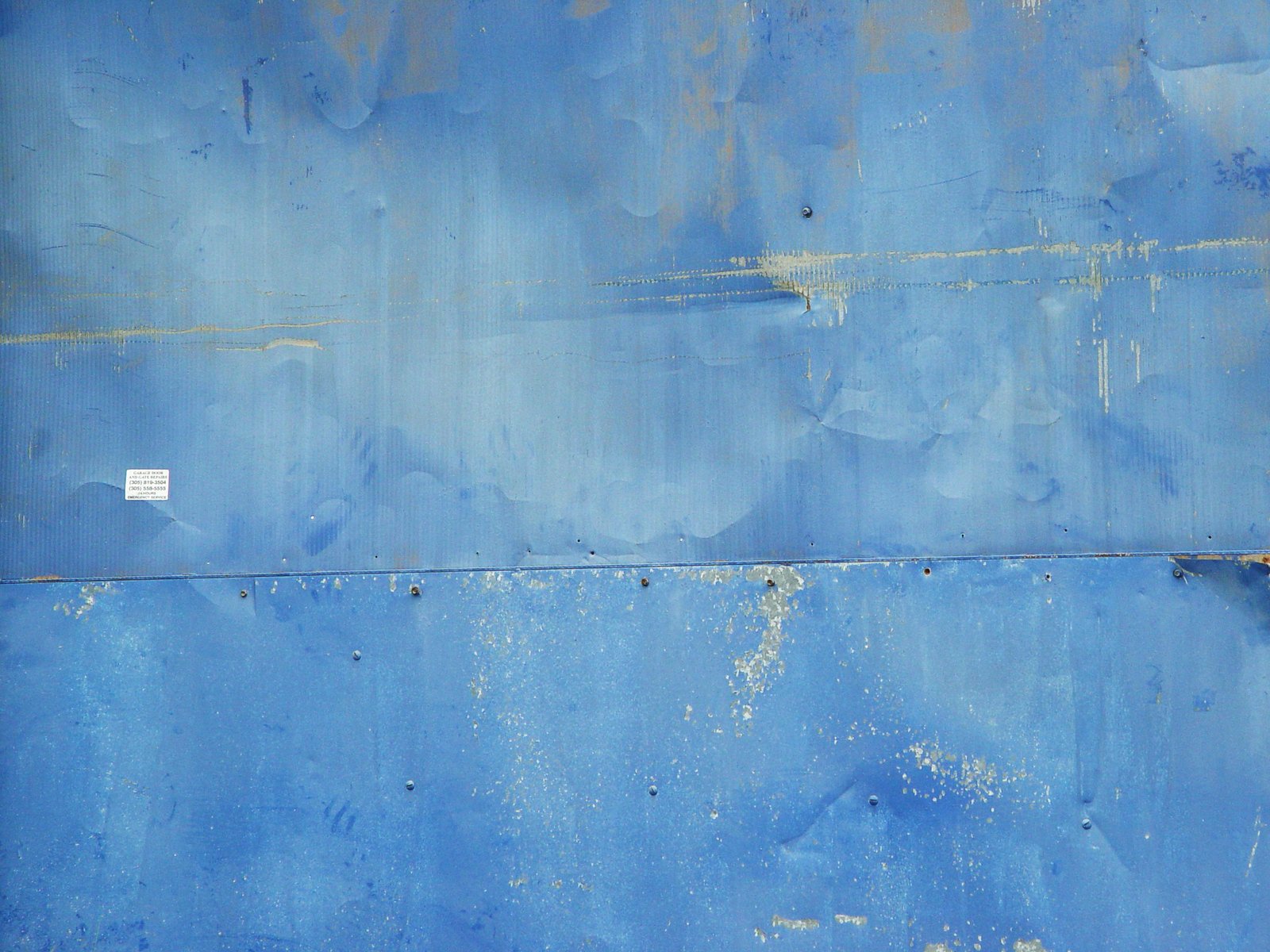 a close up s of the side of an old blue surface