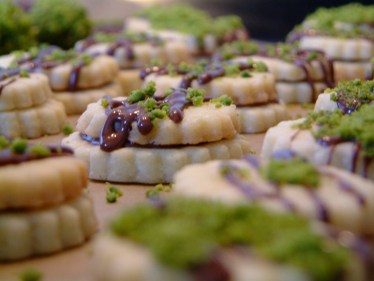 the appetizers are covered with green and purple candies