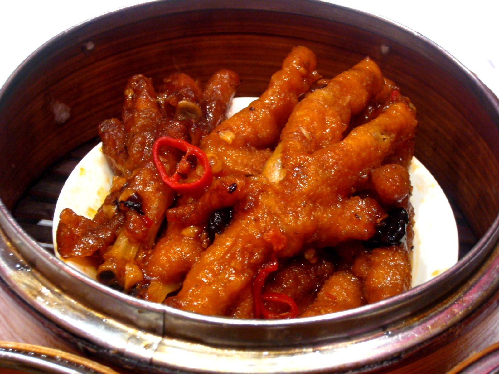 a bowl filled with fried meat and vegetables