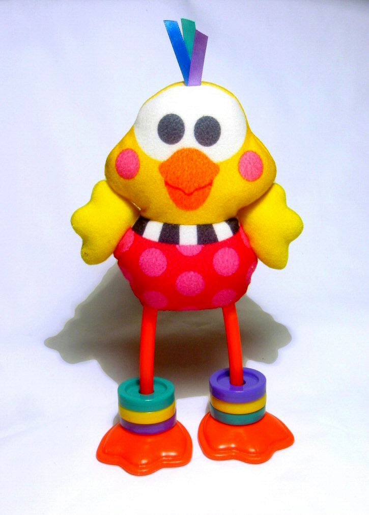 a plastic toy with a bright colored head and boots