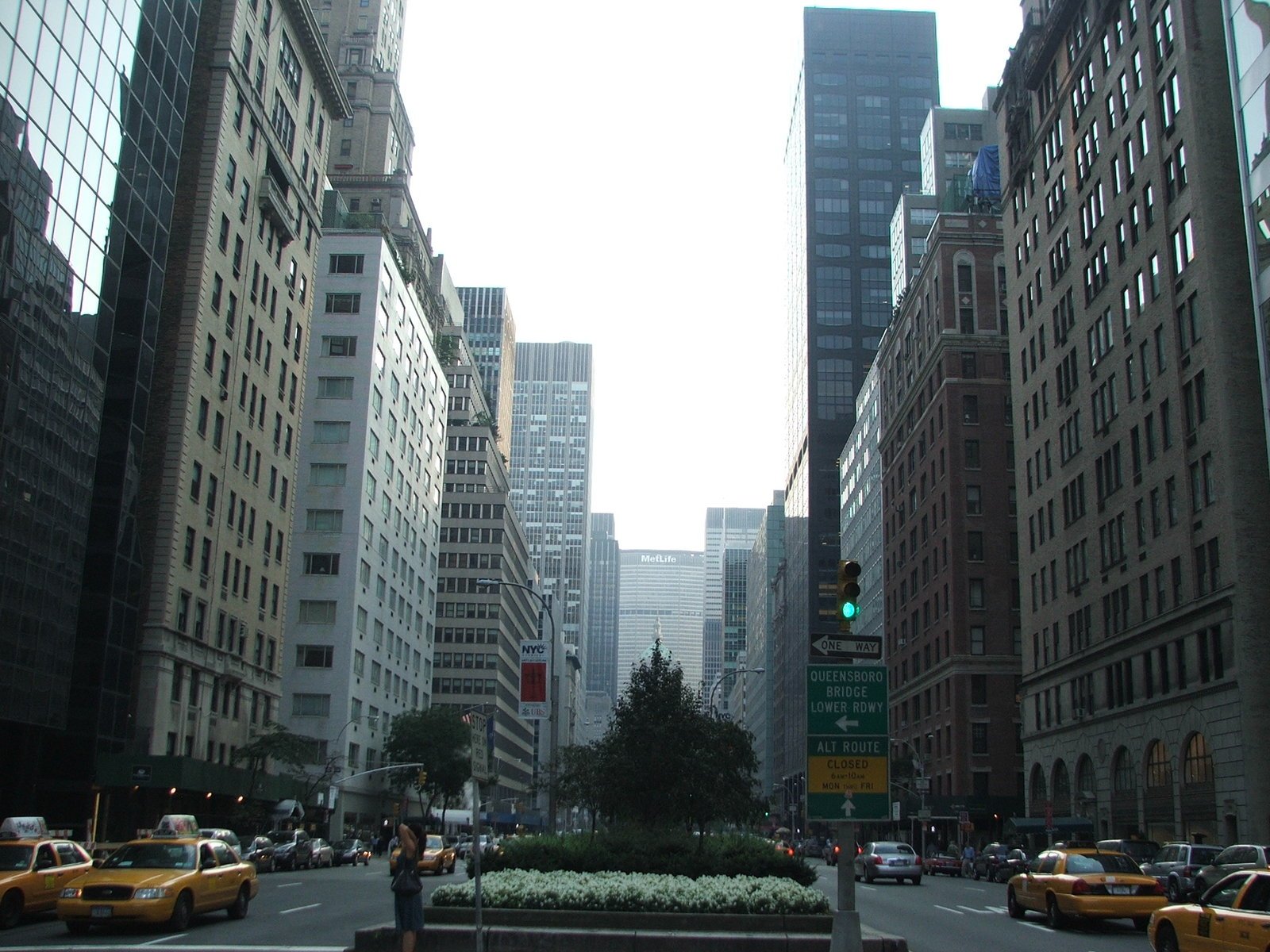 a street in new york city that is surrounded by tall buildings