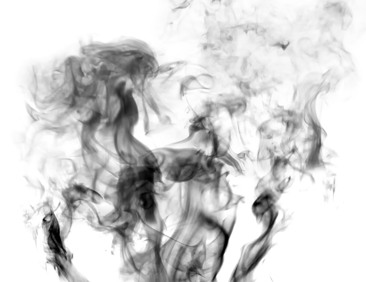black and white pograph of smoke blowing from the top