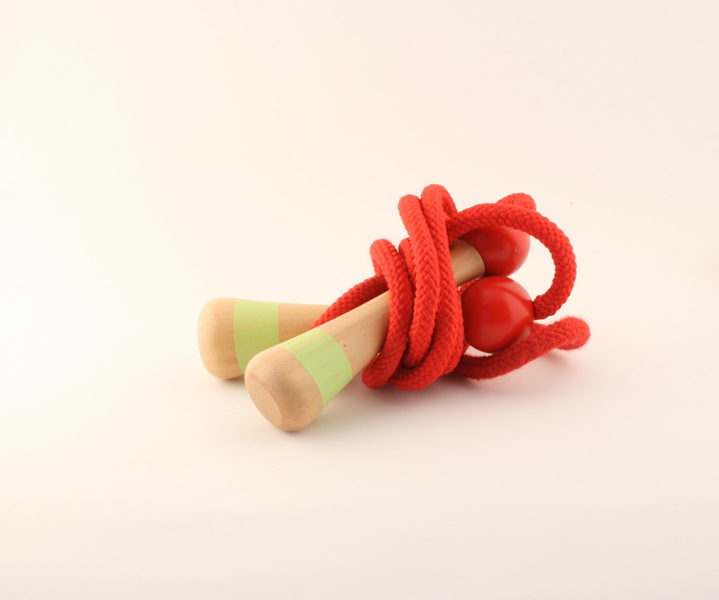 a toy with three wooden objects attached to it