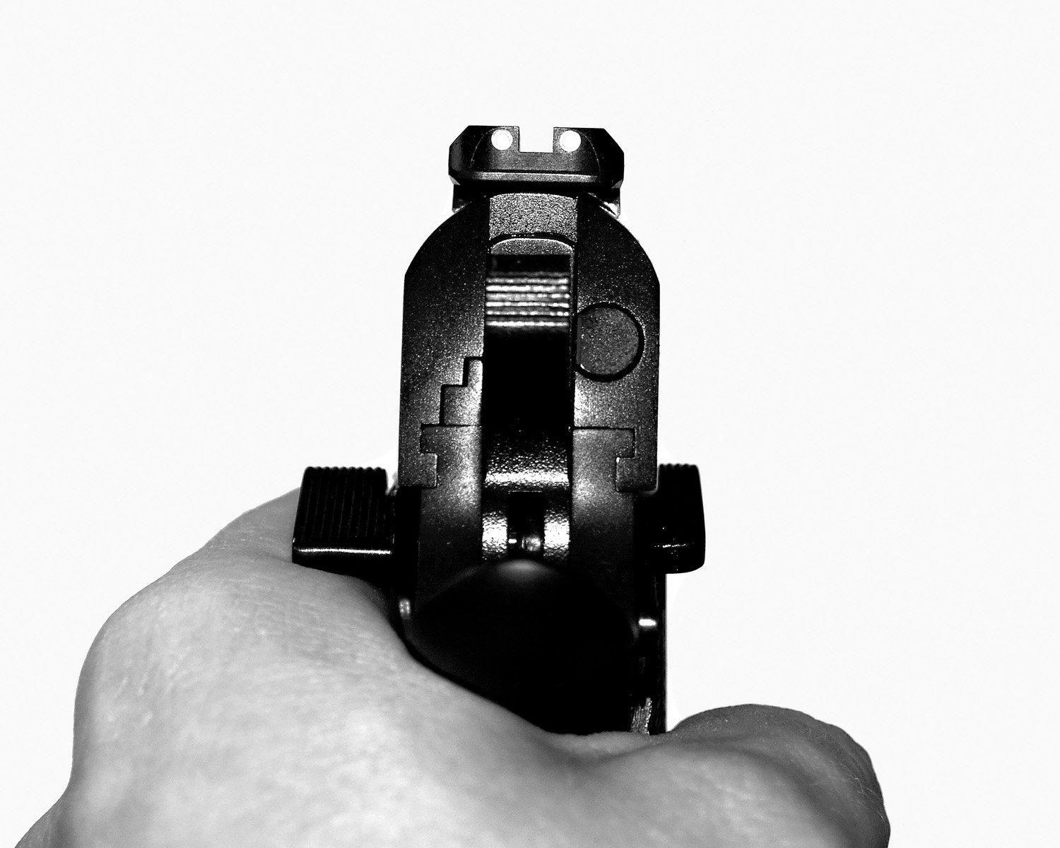 a hand holding a video camera with its back view facing in the camera