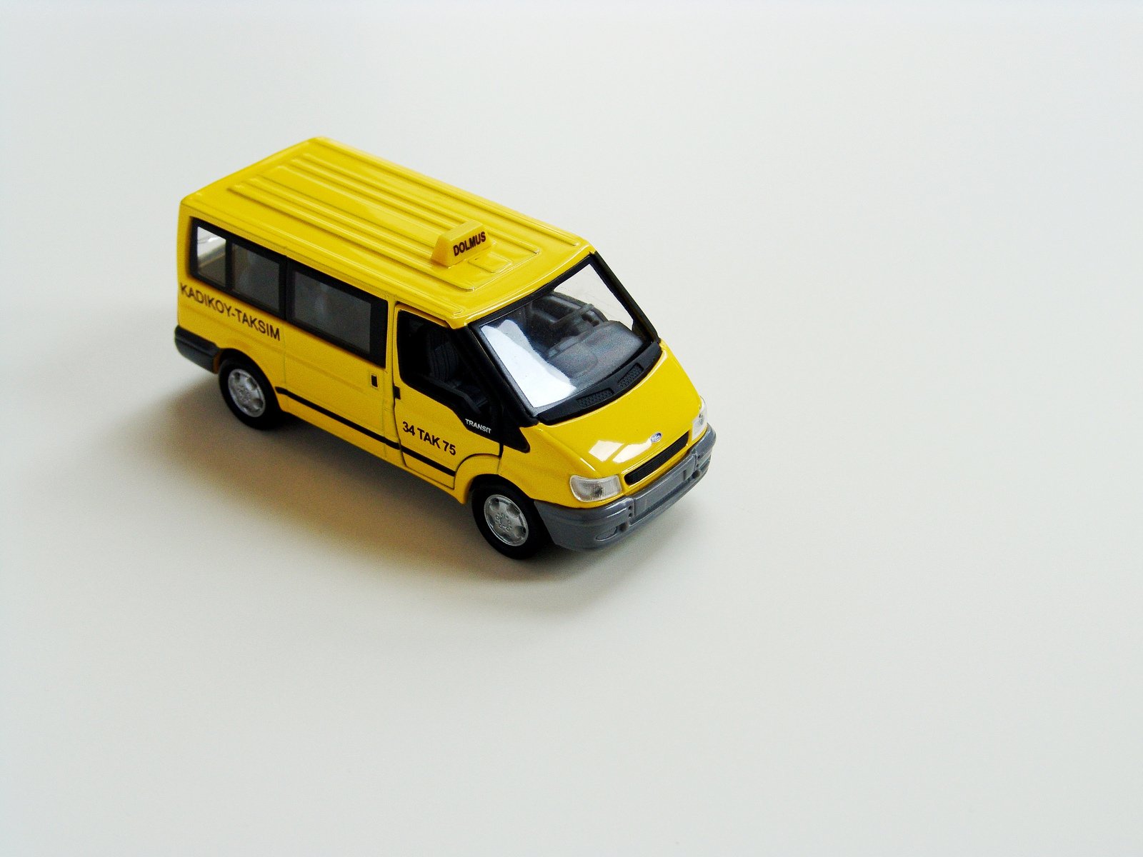 the toy bus is sitting on a table