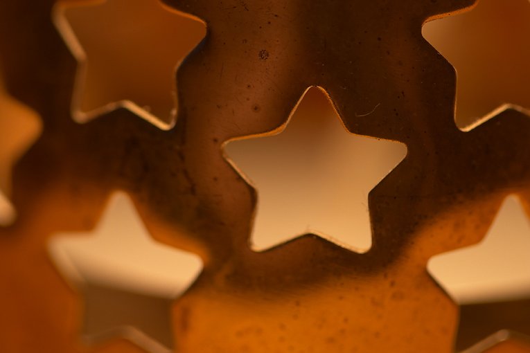 star shaped cookie cutters arranged as stars on a surface