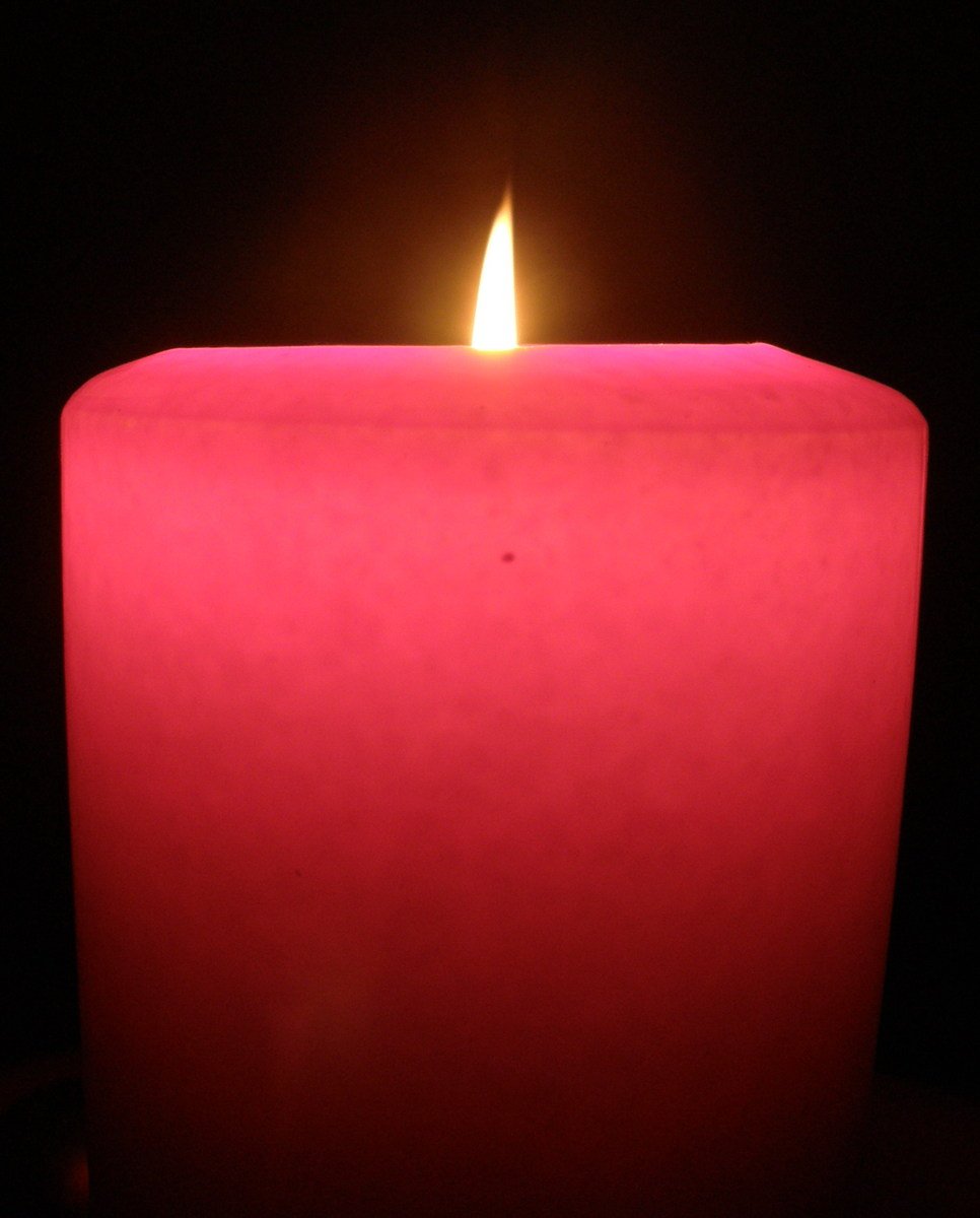 there is an up close picture of a large red candle