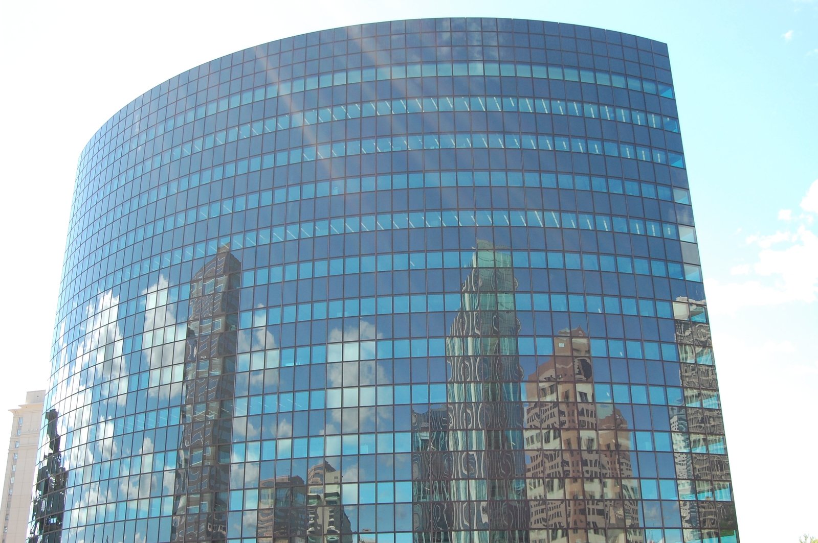 a large round blue building with many windows