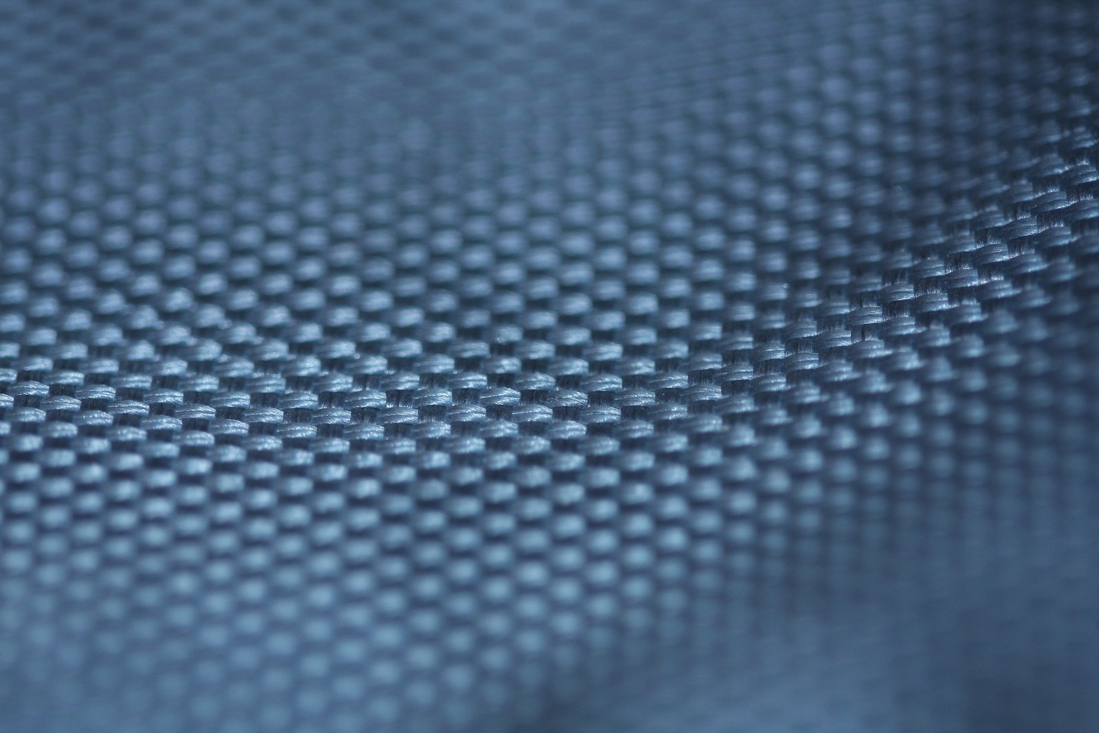 a background of blue, light blue and light grey woven material