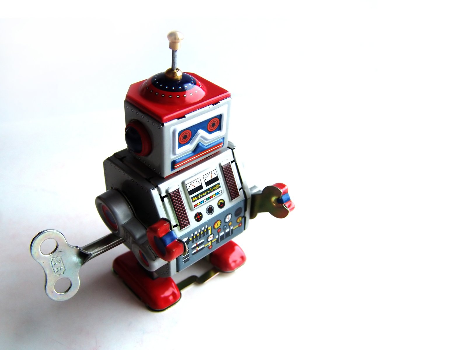 the little robot toy is red, grey and silver