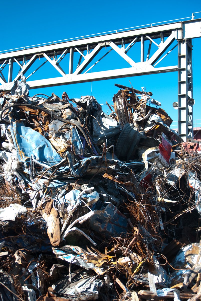 a very large pile of broken and wrecked cars