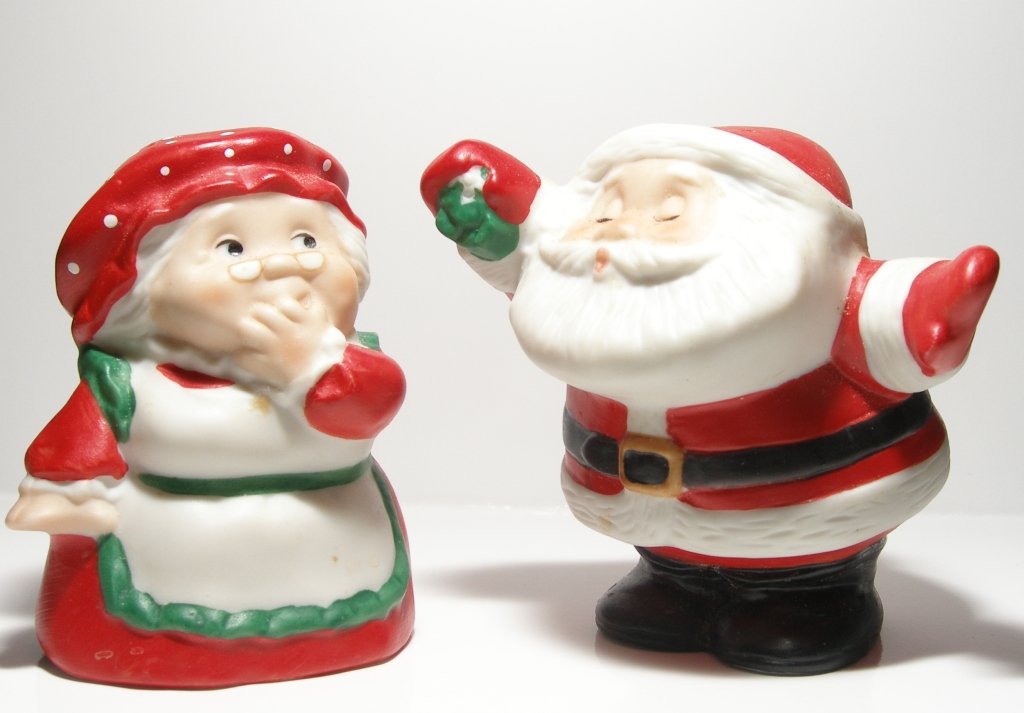 two glass statues of santa claus and snowman
