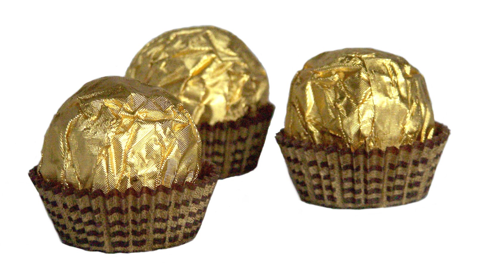 three foiled golden eggs are in their wrappers