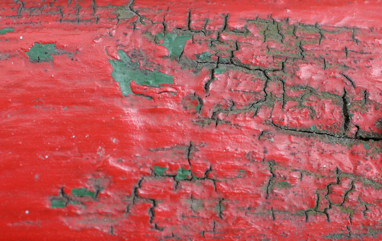 a close up of the side of a red and black bench