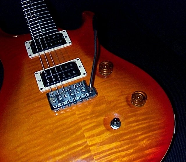 an electric guitar with a wooden body and frets