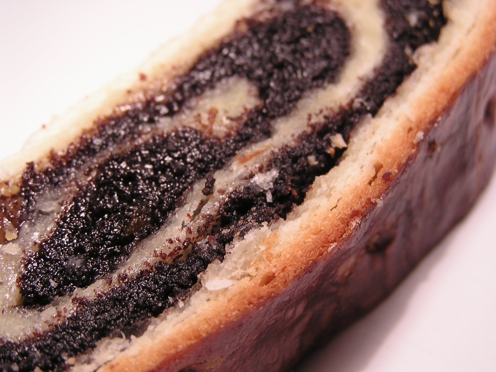 a piece of bread with chocolate fillings and chocolate sprinkles