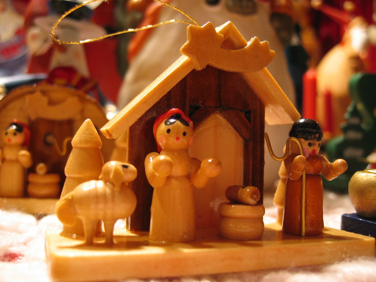 a nativity scene, including figurines of a family with a baby in the mangeroo