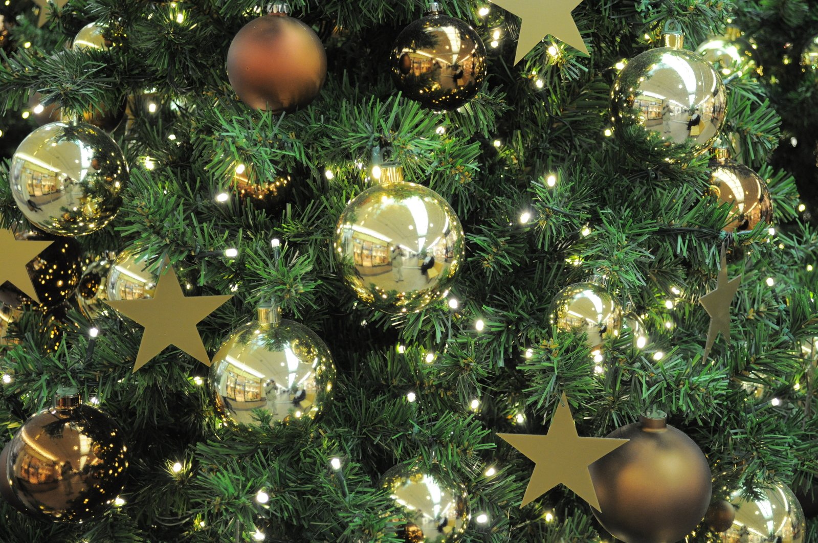 a closeup s of shiny christmas decorations on a tree