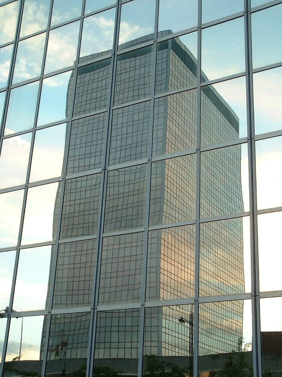 large office building seen through glass windows