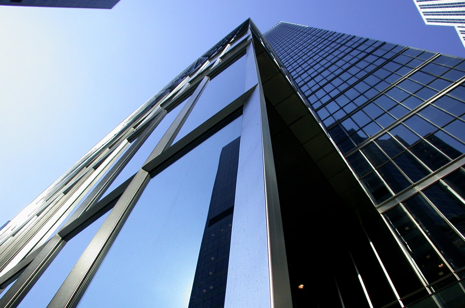 looking up at an upward glass skyscr