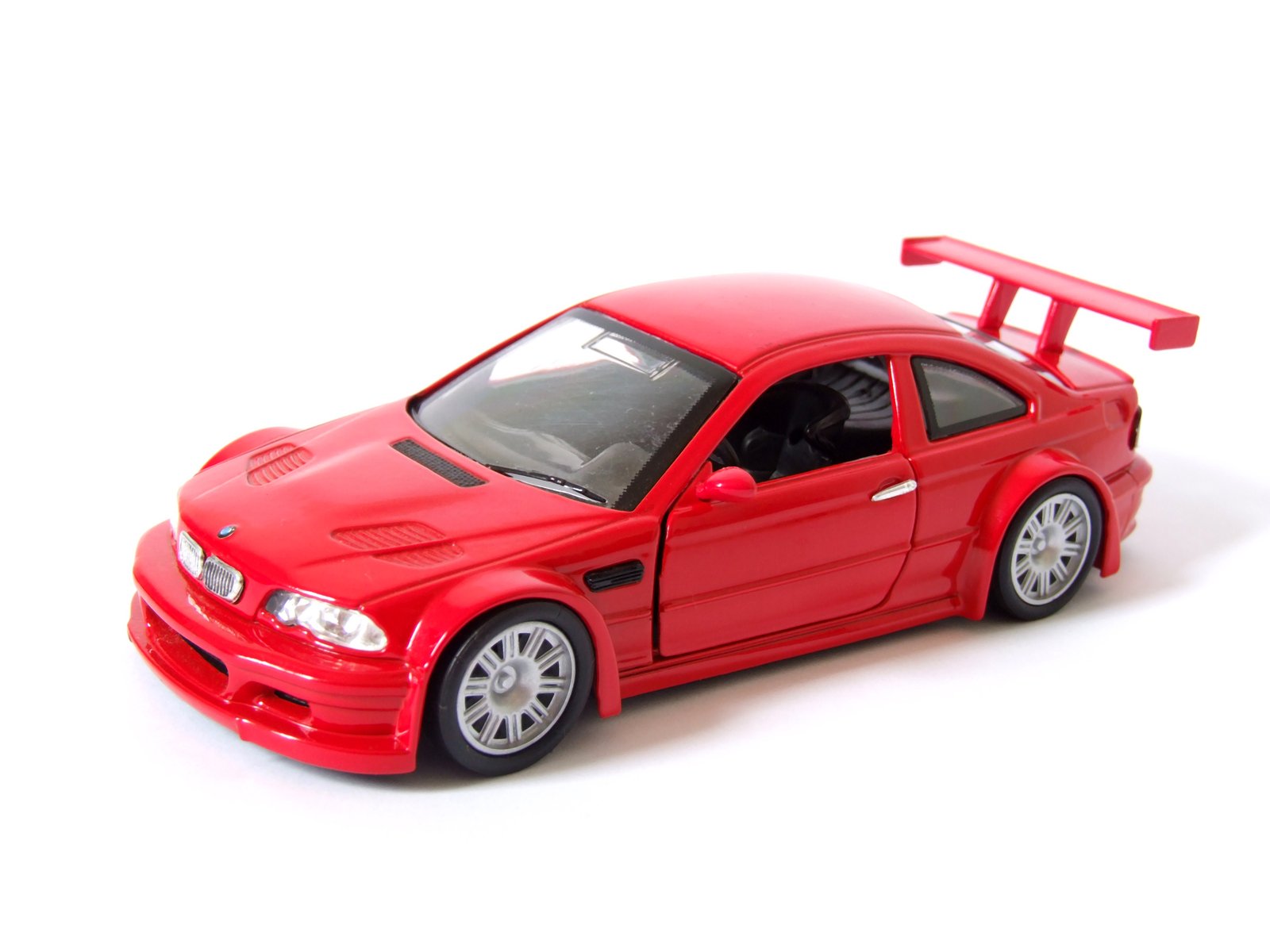 a model red racing car with the hood up
