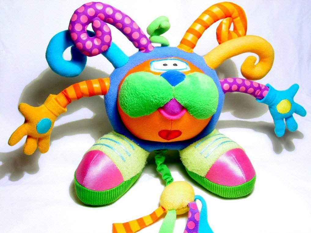 the large toy is made of soft, multicolored material