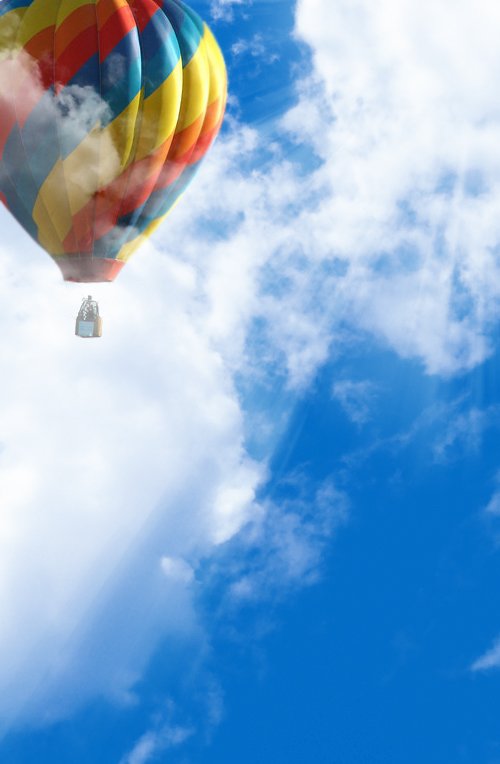 a colorful  air balloon is flying through the air