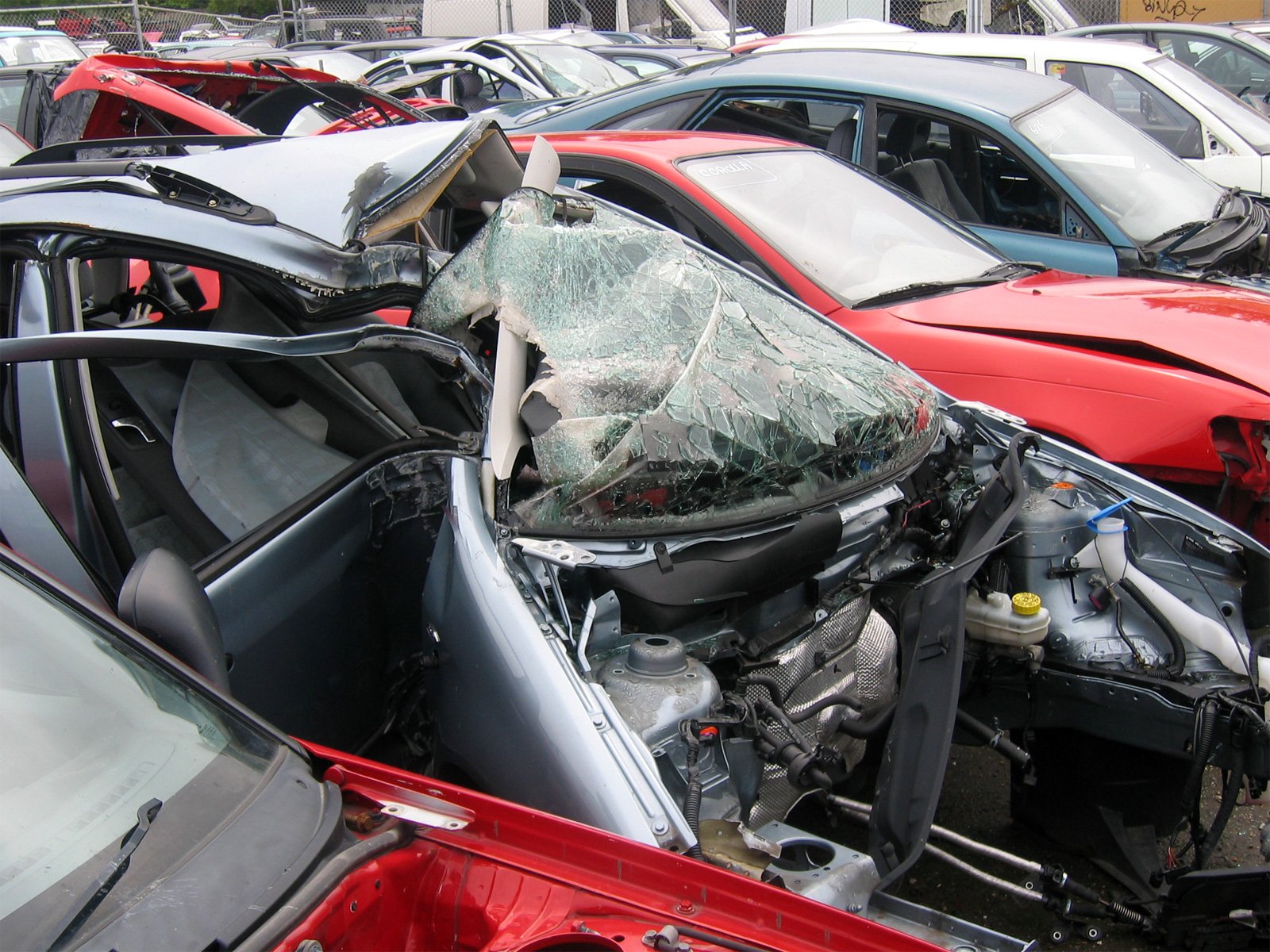 an accident involving the rear hood and driver's door of the wrecked red car