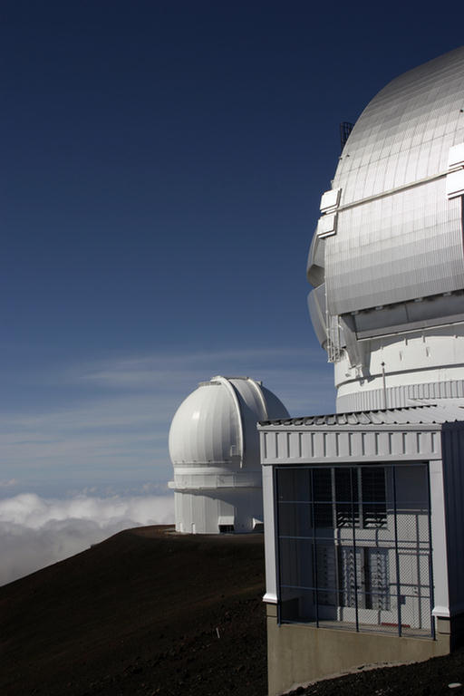 two huge telescopes sit atop the mountain