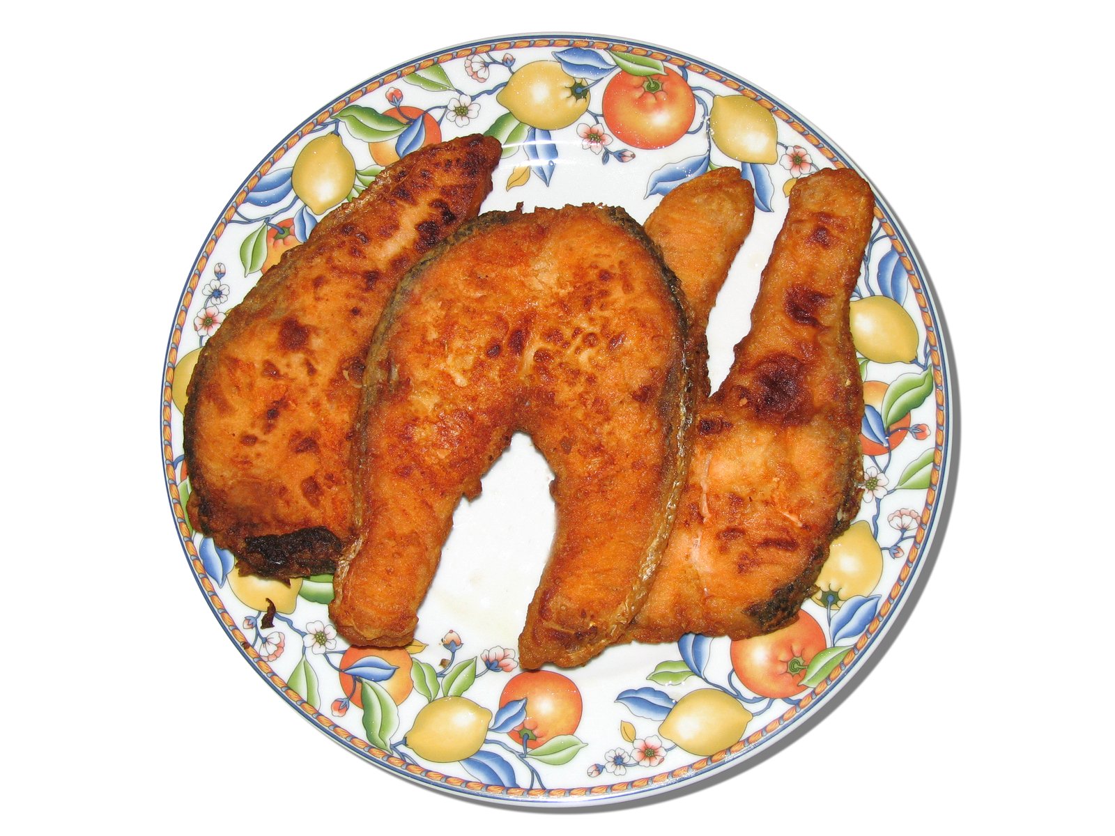 a plate with some chicken cut out on it