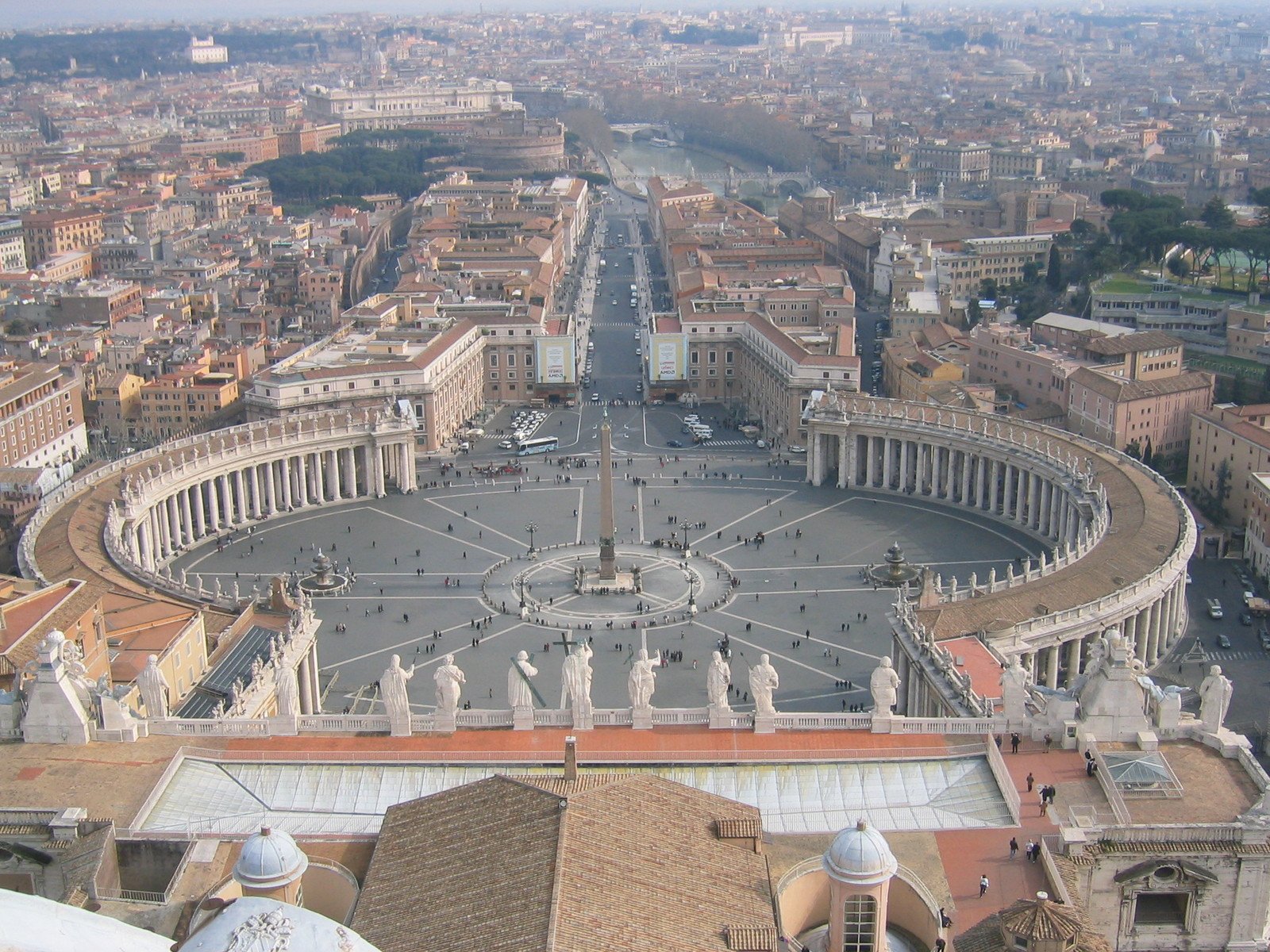 this aerial view shows the dome of an historic church in a large city square