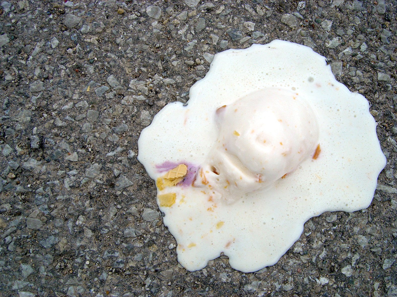 the fried egg has been melted in white sauce