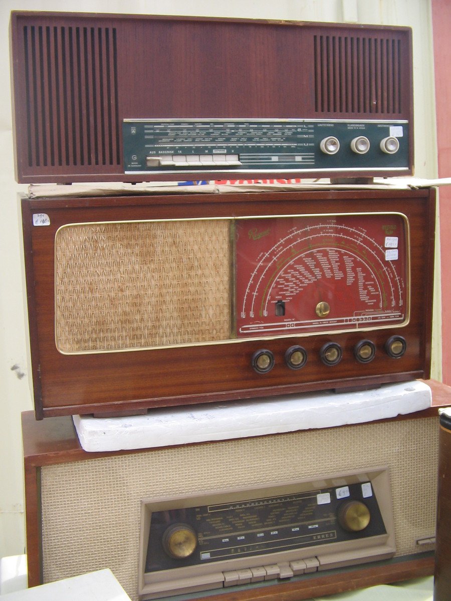 a couple of older looking radio parts sitting in a room