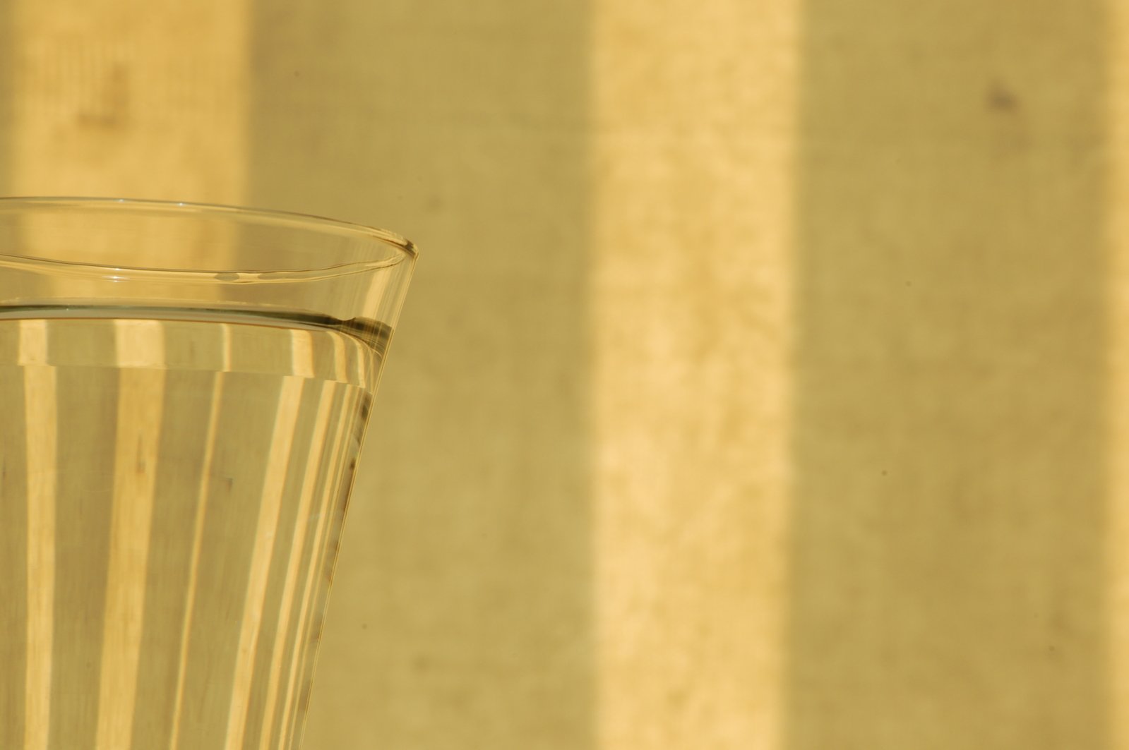 a close - up image of a glass of wine