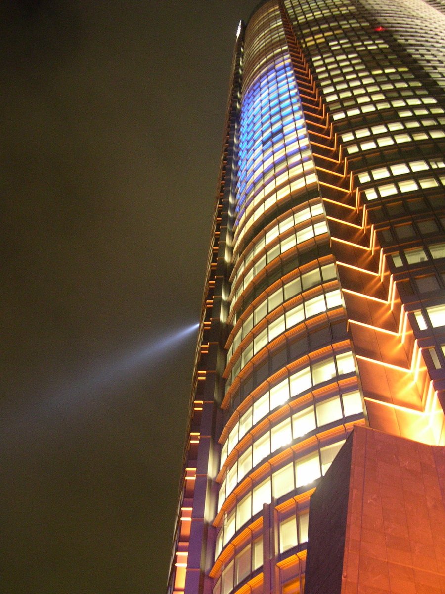 a very tall building lit up at night