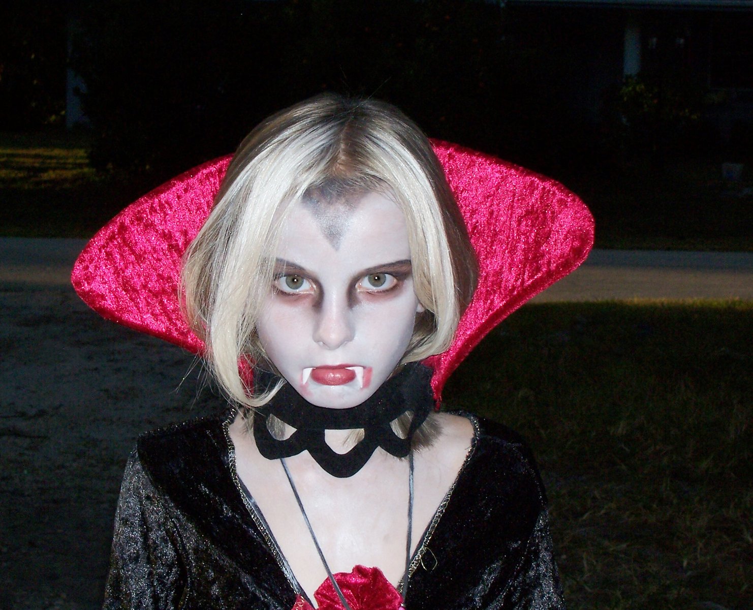 a woman in costume posing with her lips and nose open