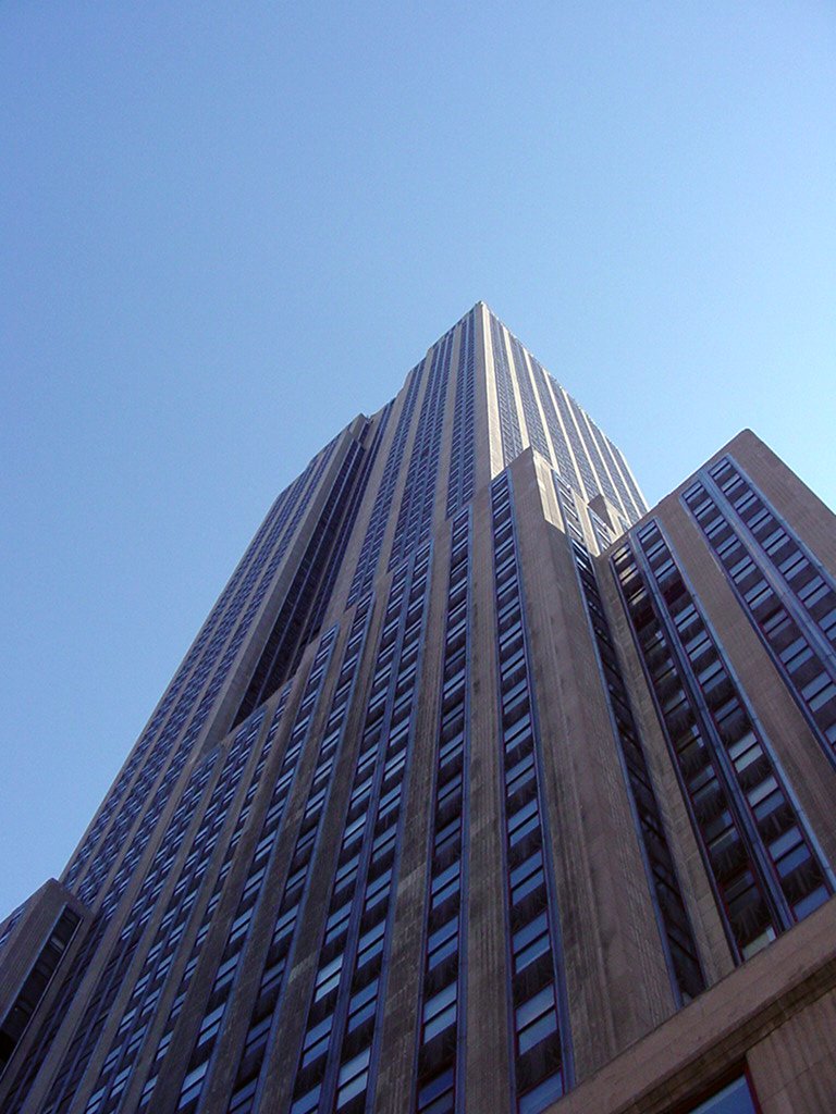 looking up at the side of a tall skyscr