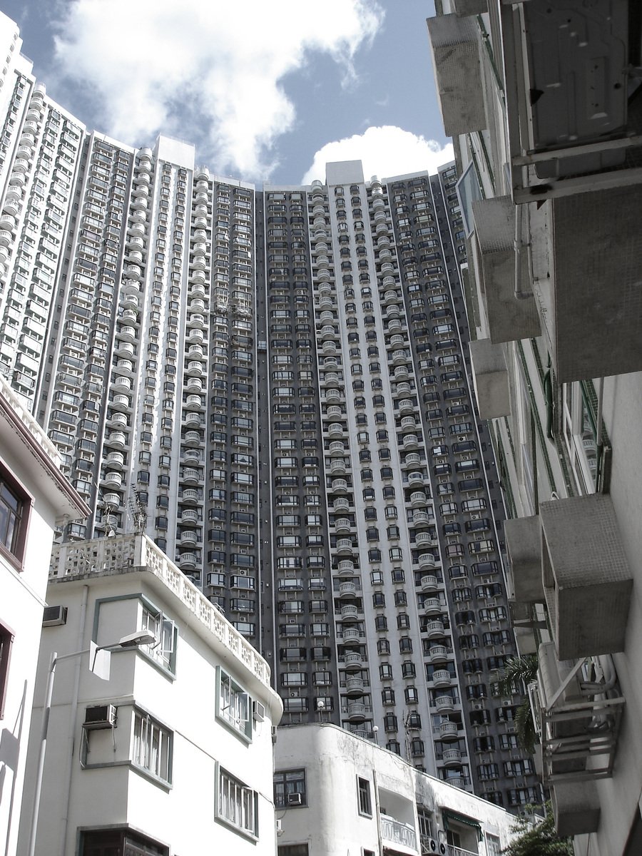 a tall building surrounded by lots of windows