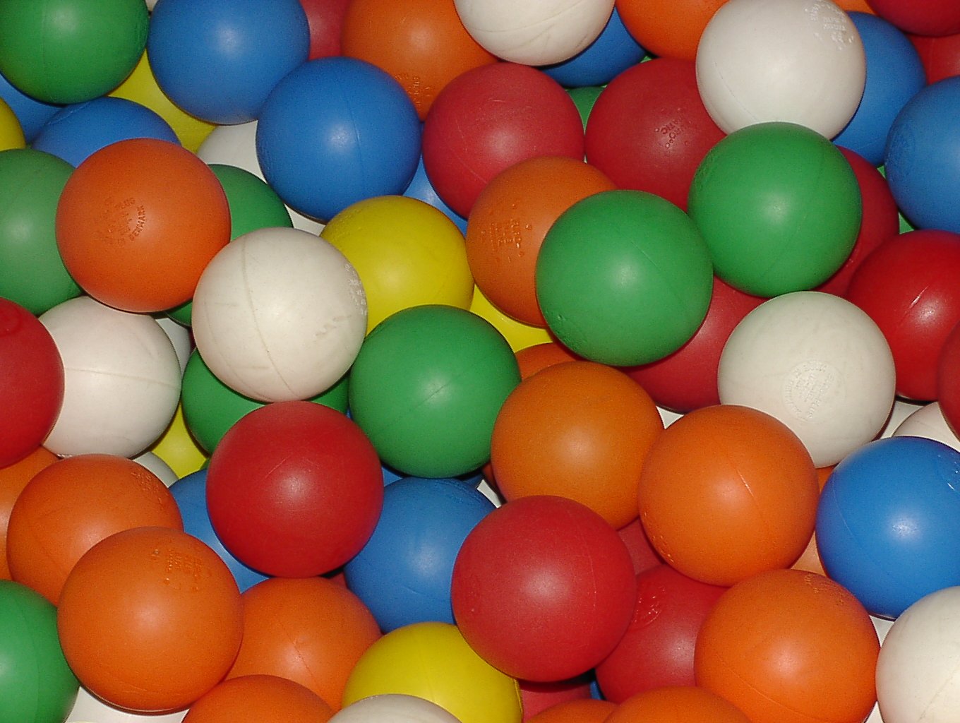 a bunch of colorful balls piled on top of each other