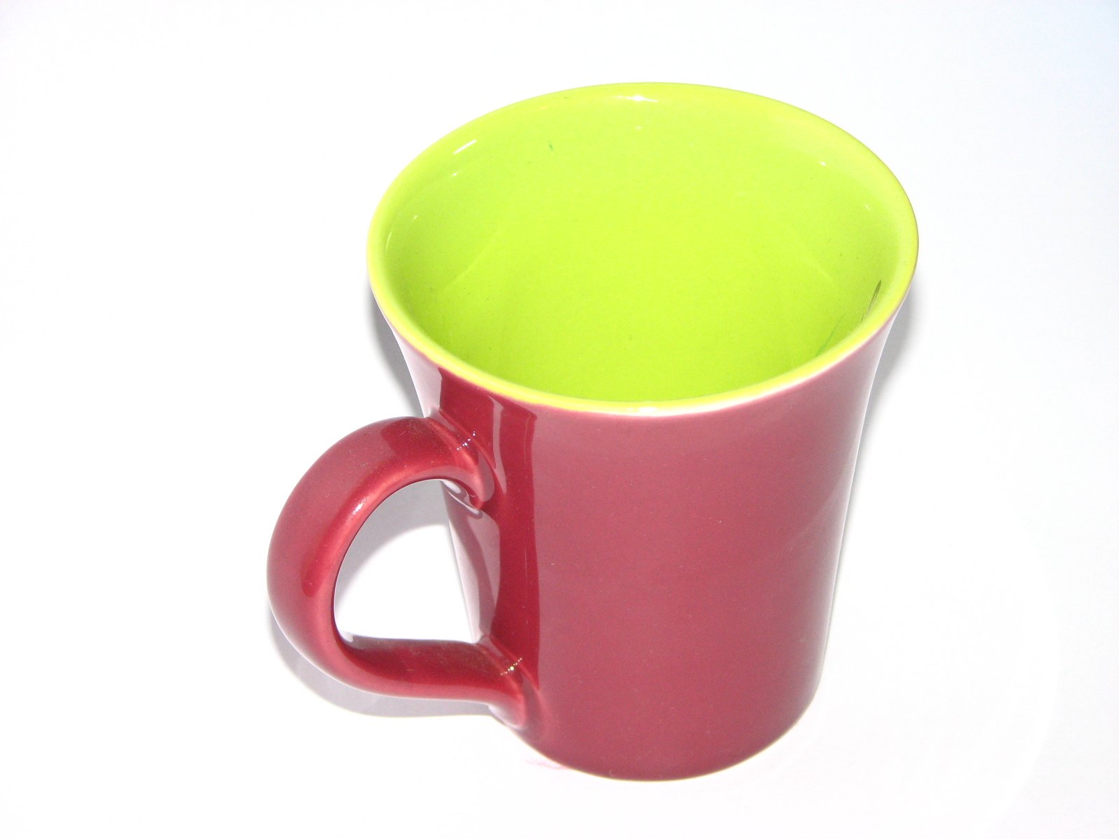 a cup sits in the foreground with a white background