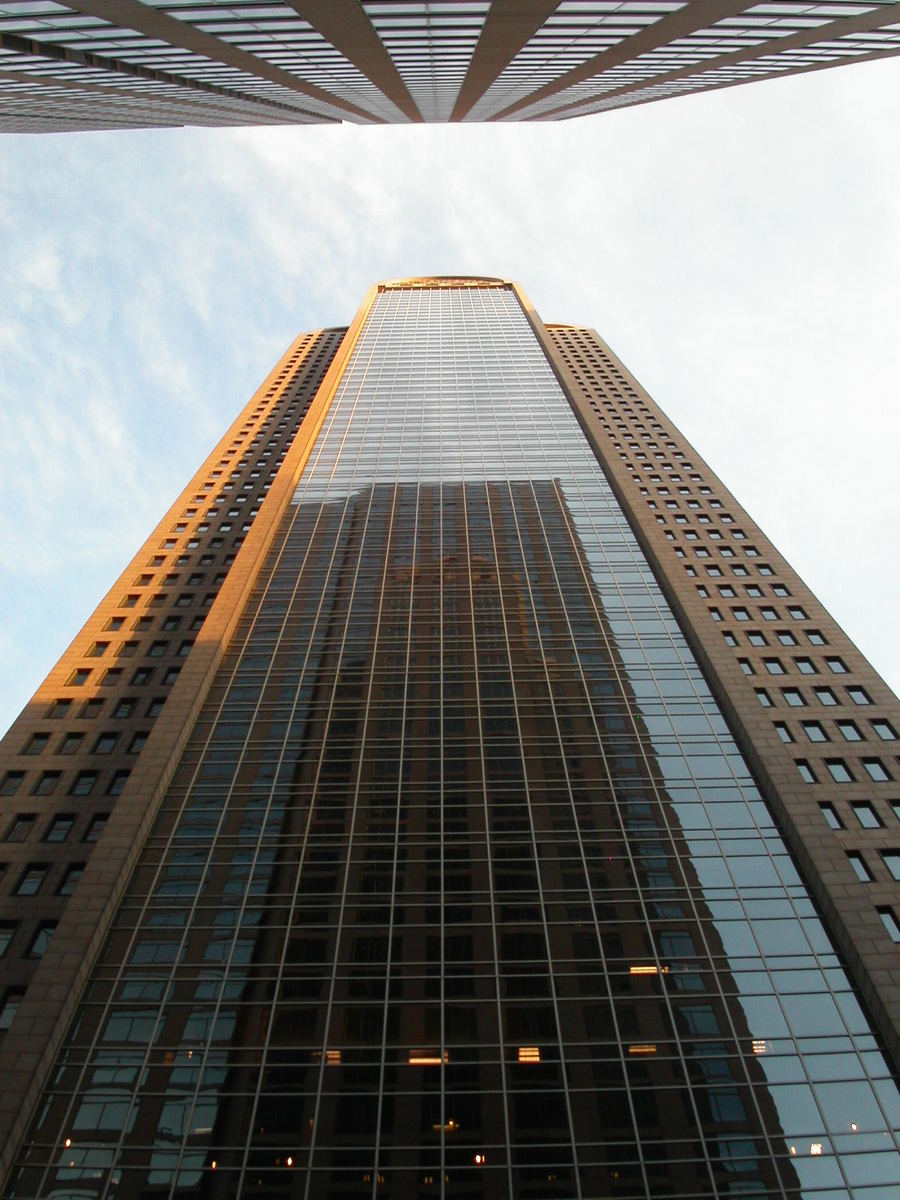 a picture of a high rise with skyscrs in the background