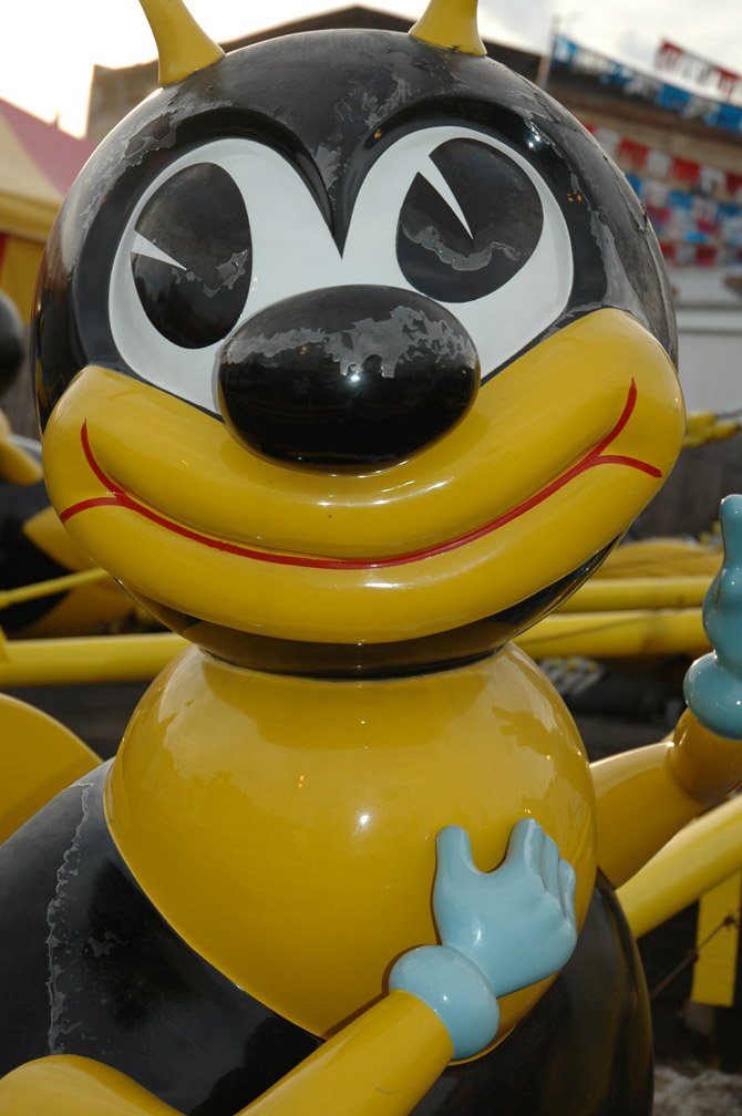 an old fashioned rubber figure that is yellow and black