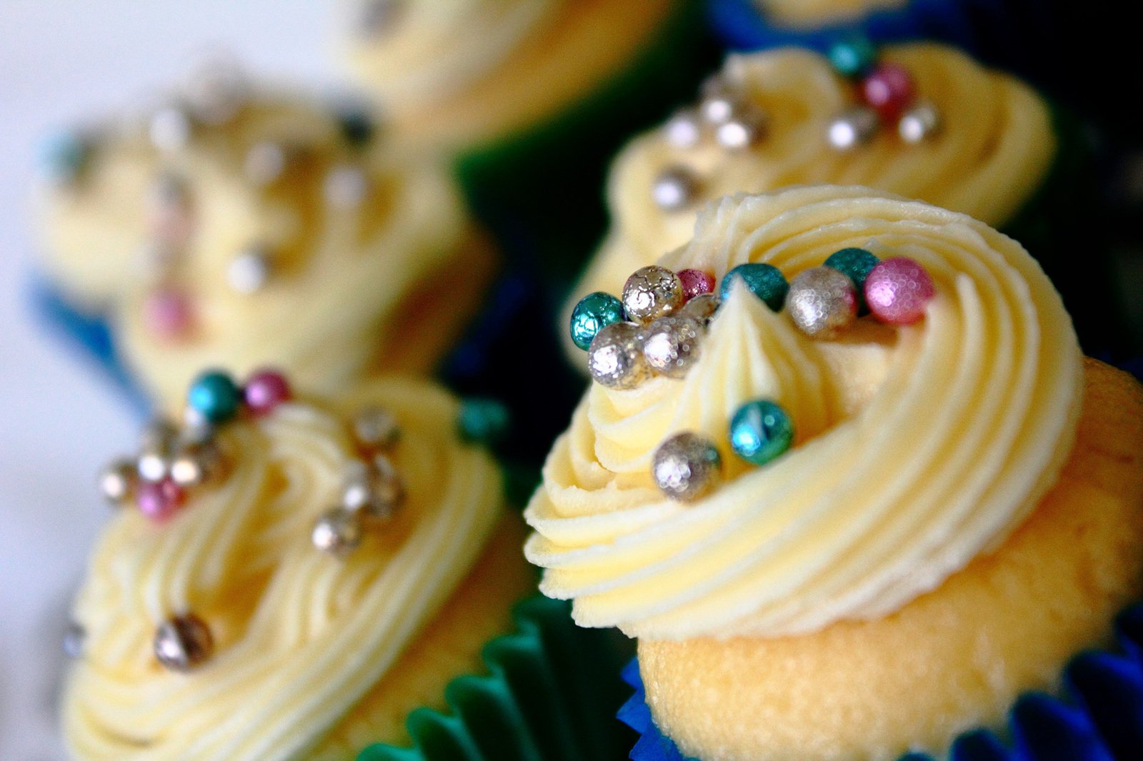 a close up of some cupcakes decorated with beads