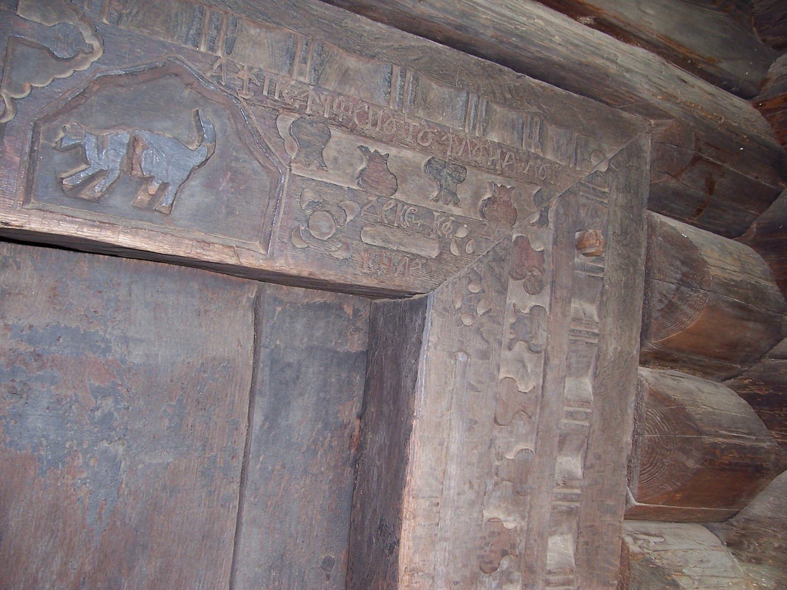 an ornate carved stone door with carvings on it