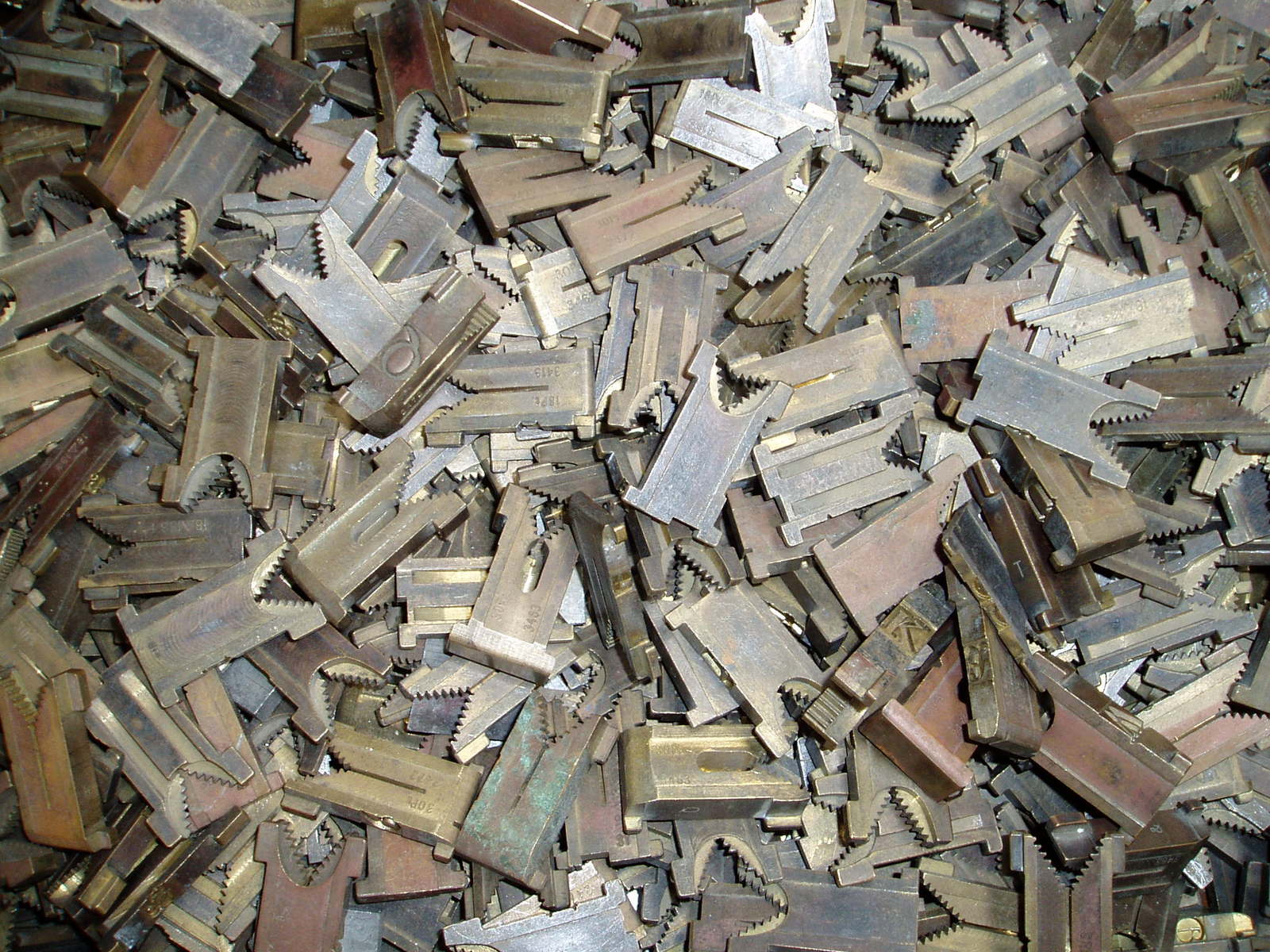 a pile of metal tools and parts that is full of tools